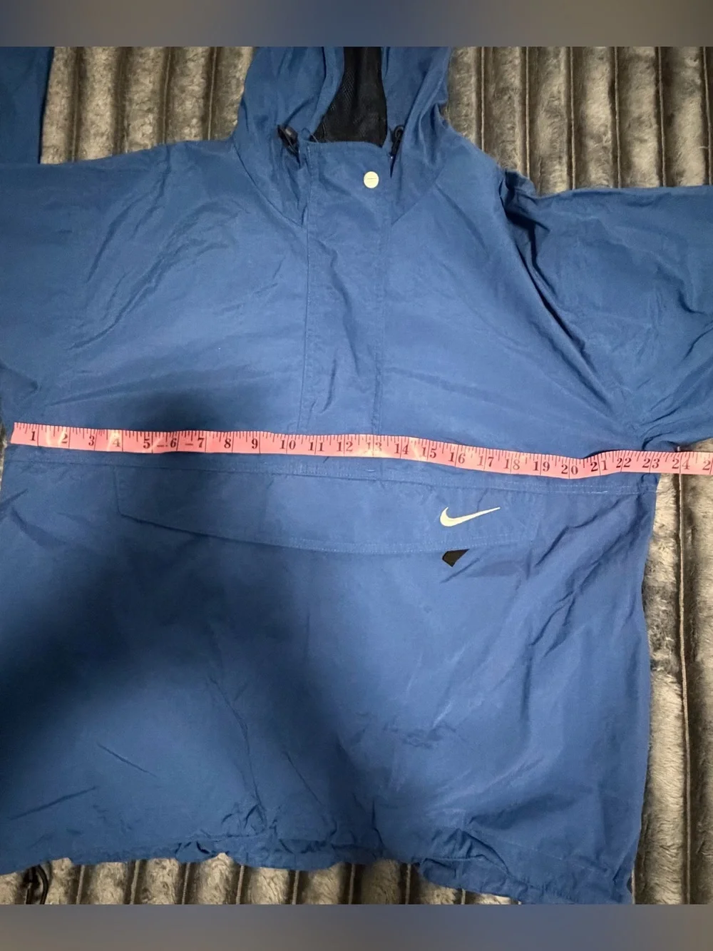 Nike Red Swoosh on White Brand Tag with Blue Fabric